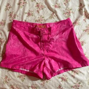 super cute hot pink tie dye y2k swimshorts with hibiscus print on the back